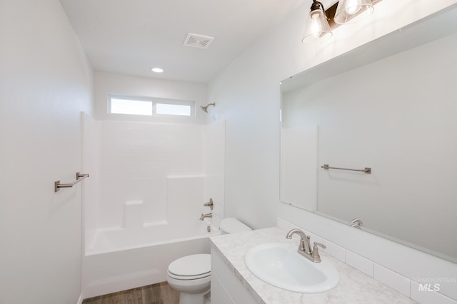 5289 E Grizzly St, Nampa, ID 83687 - bathroom featuring toilet, visible vents, shower / tub combination, vanity, and wood finished floors