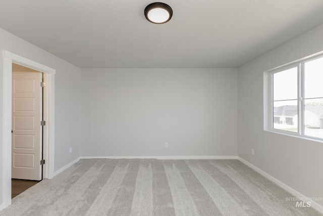 5289 E Grizzly St, Nampa, ID 83687 - empty room featuring light colored carpet and baseboards