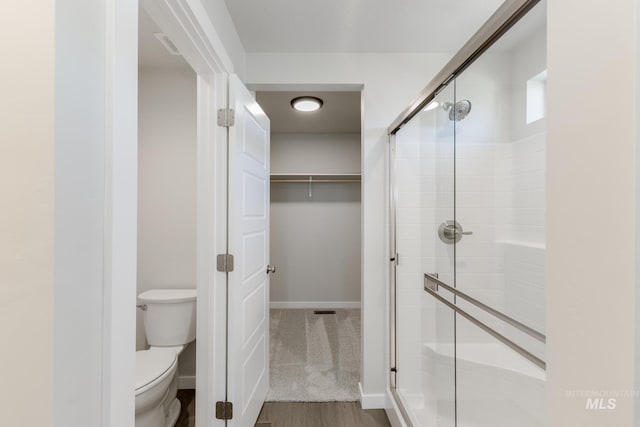 5289 E Grizzly St, Nampa, ID 83687 - full bath featuring a shower stall, a walk in closet, toilet, and baseboards
