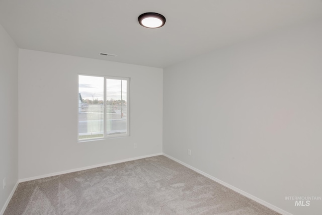 5289 E Grizzly St, Nampa, ID 83687 - empty room with carpet floors and baseboards