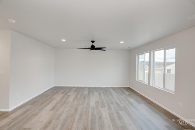 5289 E Grizzly St, Nampa, ID 83687 - empty room with ceiling fan, light wood finished floors, baseboards, and recessed lighting