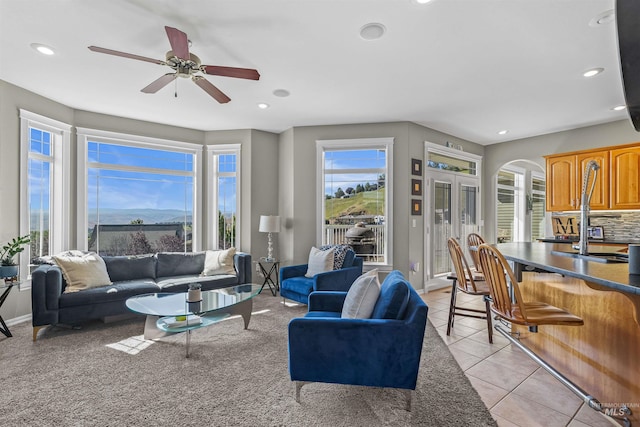 2570 Reservoir Rd, Clarkston, WA 99403 - living room with arched walkways, ceiling fan, light tile patterned floors, recessed lighting, and baseboards