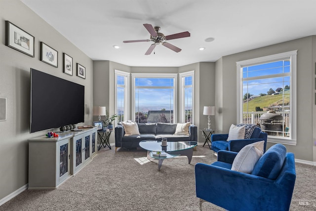 2570 Reservoir Rd, Clarkston, WA 99403 - living area with carpet floors, baseboards, healthy amount of natural light, and a ceiling fan