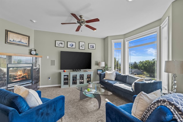 2570 Reservoir Rd, Clarkston, WA 99403 - living room featuring carpet floors, a ceiling fan, a fireplace, and baseboards
