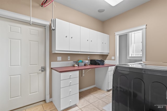 2570 Reservoir Rd, Clarkston, WA 99403 - kitchen featuring washer / clothes dryer, white cabinetry, and light tile patterned flooring