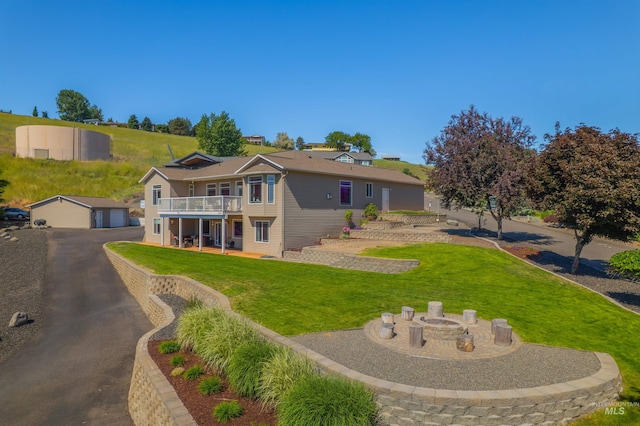 2570 Reservoir Rd, Clarkston, WA 99403 - rear view of house with a lawn and a detached garage