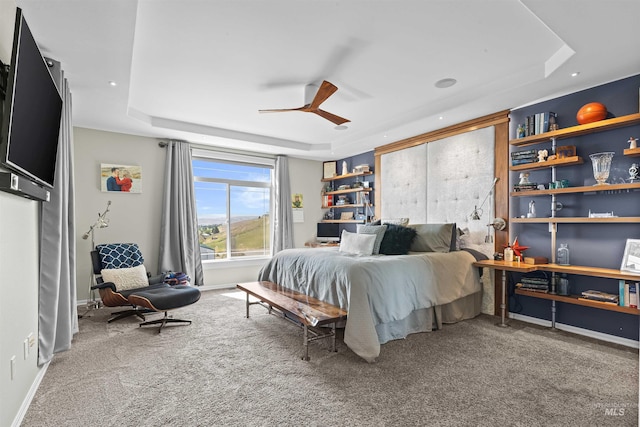 2570 Reservoir Rd, Clarkston, WA 99403 - carpeted bedroom with a tray ceiling, baseboards, and ceiling fan