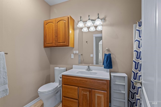 2570 Reservoir Rd, Clarkston, WA 99403 - bathroom with vanity, toilet, baseboards, and tile patterned floors