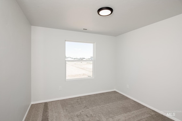 spare room with carpet floors