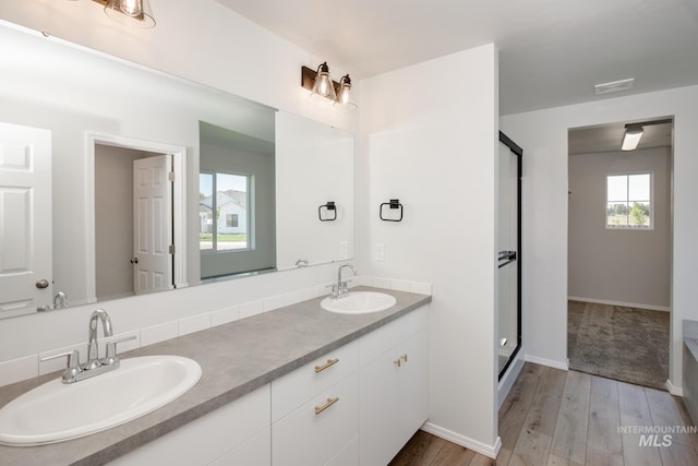bathroom with vanity and hardwood / wood-style floors