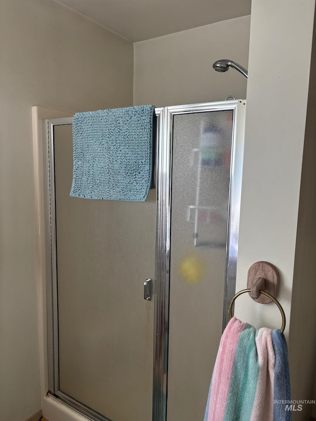 full bath with a shower stall