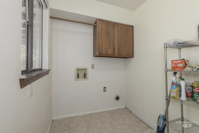 5132 S Council Bluffs Way, Boise, ID 83716 - laundry area featuring washer hookup, electric dryer hookup, cabinet space, baseboards, and light tile patterned flooring