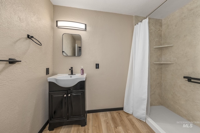 5132 S Council Bluffs Way, Boise, ID 83716 - bathroom featuring vanity, wood finished floors, and a shower with curtain