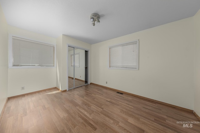 5132 S Council Bluffs Way, Boise, ID 83716 - unfurnished bedroom featuring light wood-style floors, baseboards, and a closet