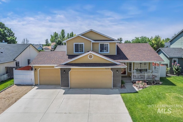 7699 Cedarbrook Dr, Nampa, ID 83687 - view of front of property with covered porch, concrete driveway, an attached garage, a shingled roof, and brick siding