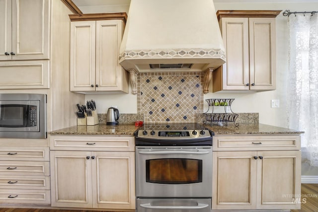 3408 Ridgeline Dr, Kimberly, ID 83341 - kitchen with tasteful backsplash, custom exhaust hood, light stone counters, and stainless steel appliances