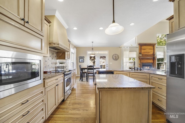 3408 Ridgeline Dr, Kimberly, ID 83341 - kitchen with a wealth of natural light, a sink, light stone counters, and appliances with stainless steel finishes