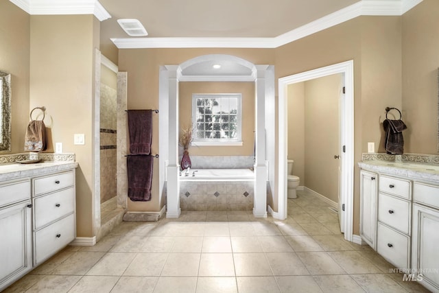 3408 Ridgeline Dr, Kimberly, ID 83341 - bathroom featuring ornamental molding, toilet, vanity, decorative columns, and a garden tub