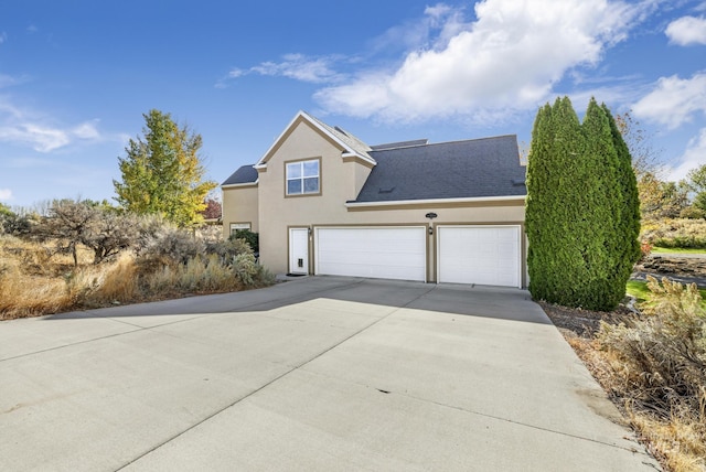 3408 Ridgeline Dr, Kimberly, ID 83341 - traditional home with a garage, driveway, and stucco siding