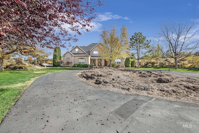 3408 Ridgeline Dr, Kimberly, ID 83341 - view of front of home featuring a front lawn and curved driveway