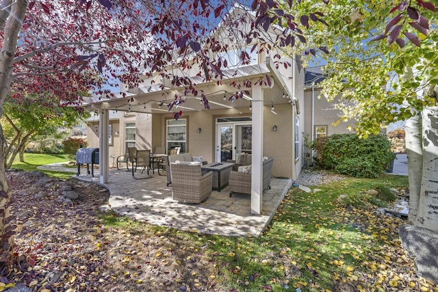 3408 Ridgeline Dr, Kimberly, ID 83341 - rear view of house featuring stucco siding and an outdoor hangout area