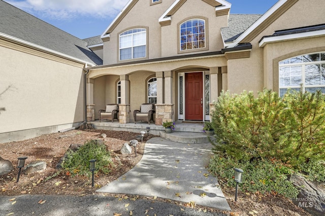 3408 Ridgeline Dr, Kimberly, ID 83341 - entrance to property featuring stucco siding, a porch, and roof with shingles