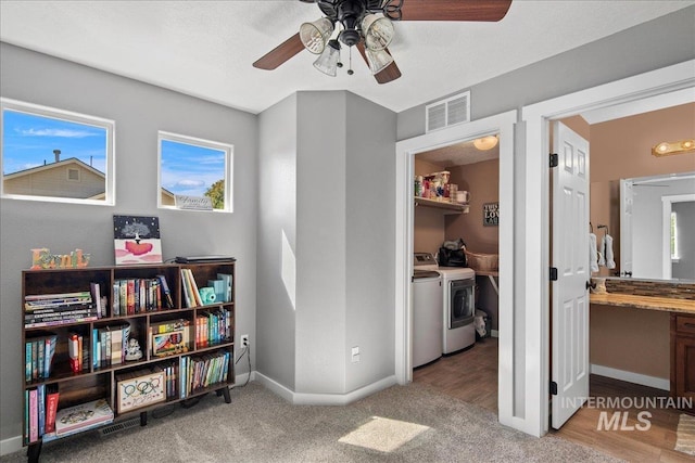 4226 E Tahiti St, Meridian, ID 83646 - bedroom featuring washer and clothes dryer, baseboards, light carpet, and a ceiling fan