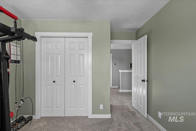 4226 E Tahiti St, Meridian, ID 83646 - unfurnished bedroom with carpet floors, a textured ceiling, baseboards, and a closet
