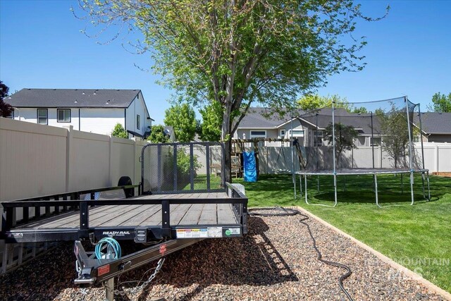 4226 E Tahiti St, Meridian, ID 83646 - view of yard with a trampoline and a wooden deck