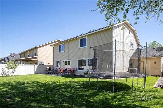 4226 E Tahiti St, Meridian, ID 83646 - back of property with a trampoline and a patio area