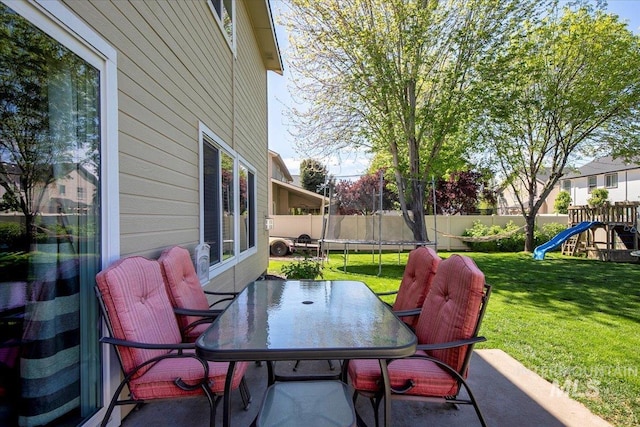 4226 E Tahiti St, Meridian, ID 83646 - view of patio featuring a trampoline, a playground, and outdoor dining area