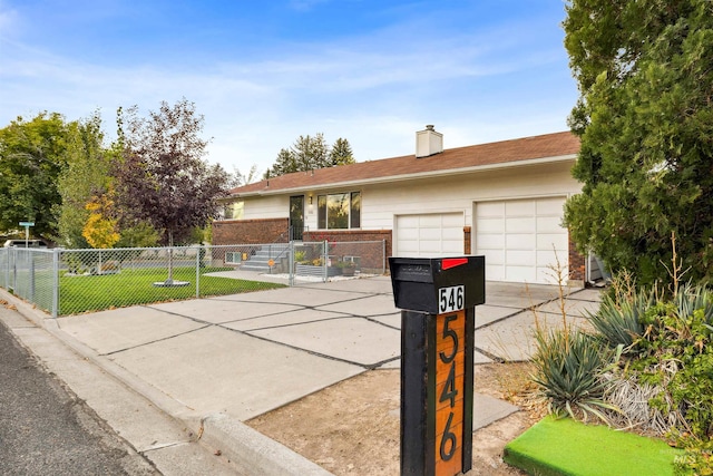 ranch-style house with a garage and a front yard