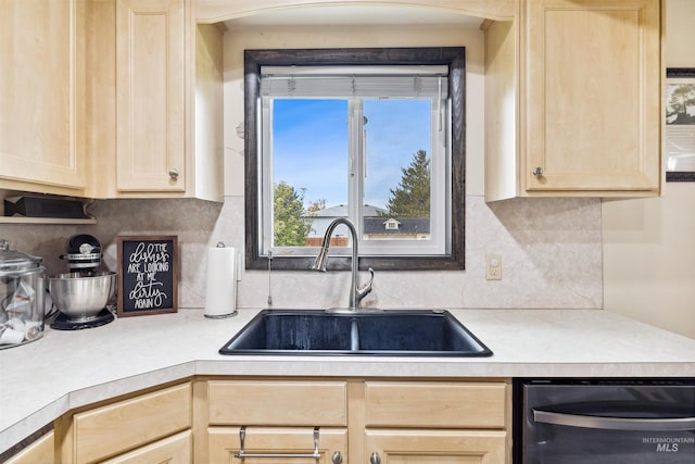 kitchen with light brown cabinets, sink, dishwasher, and backsplash