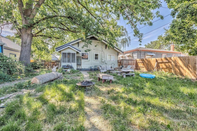 538 N 6th St, Payette, ID 83661 - rear view of house with a fire pit and a sunroom
