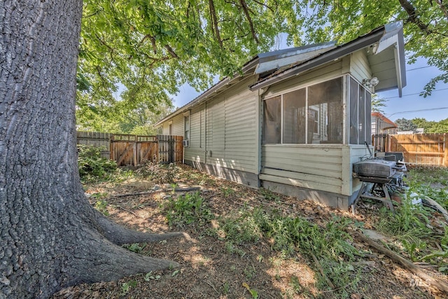 538 N 6th St, Payette, ID 83661 - view of property exterior with a fenced backyard and a sunroom