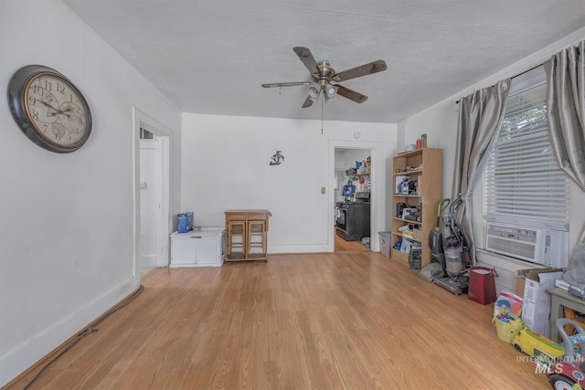 538 N 6th St, Payette, ID 83661 - living area featuring ceiling fan, light wood-style flooring, a textured ceiling, and cooling unit