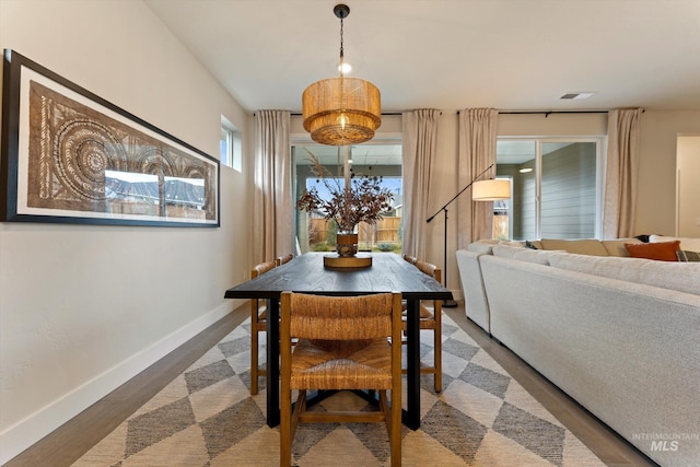 dining area featuring wood-type flooring