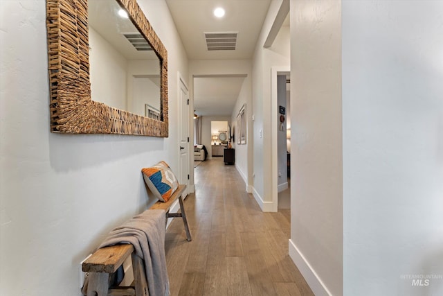 hall with light hardwood / wood-style flooring