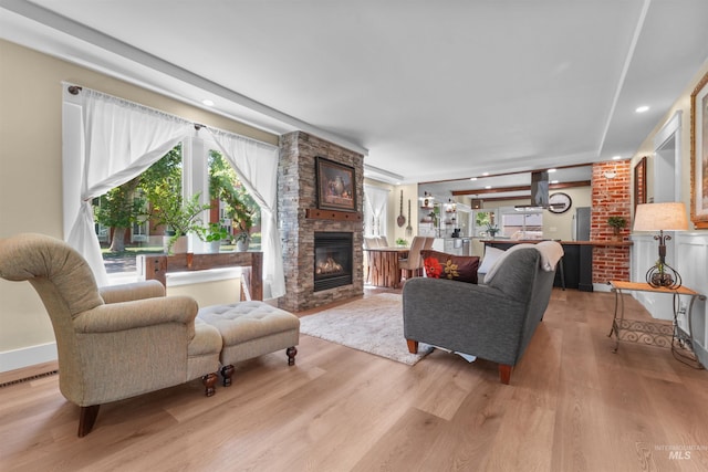 1924 Cleveland Blvd, Caldwell, ID 83605 - living room with a stone fireplace, light wood finished floors, and recessed lighting