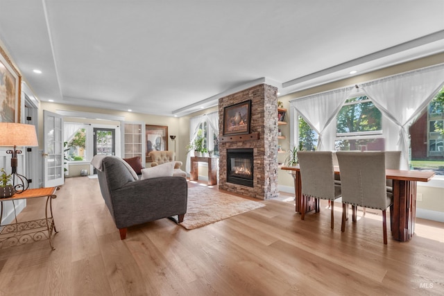 1924 Cleveland Blvd, Caldwell, ID 83605 - living room featuring light wood-style flooring, a fireplace, and healthy amount of natural light