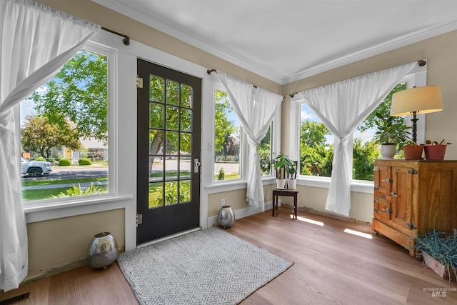 1924 Cleveland Blvd, Caldwell, ID 83605 - doorway to outside featuring crown molding, healthy amount of natural light, and wood finished floors