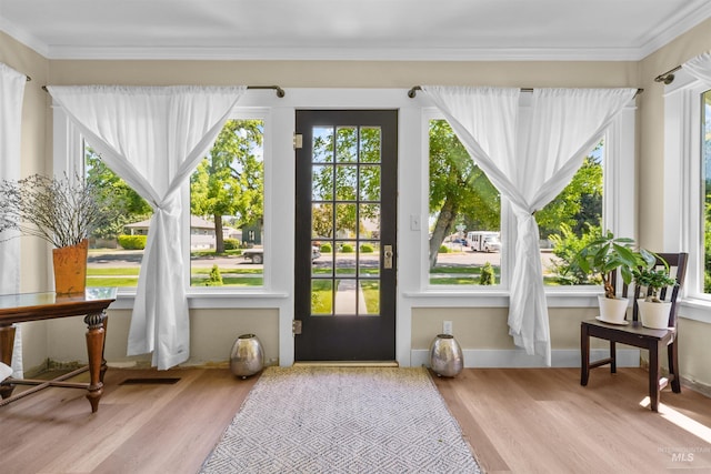 1924 Cleveland Blvd, Caldwell, ID 83605 - doorway to outside with wood finished floors and ornamental molding