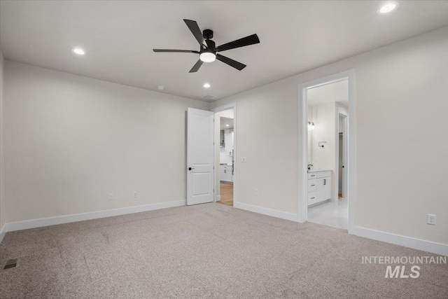 5801 W Escalante, Eagle, ID 83616 - unfurnished bedroom with recessed lighting, ensuite bathroom, light colored carpet, and baseboards