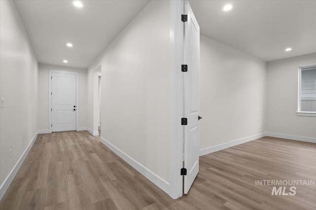 5801 W Escalante, Eagle, ID 83616 - hallway with light wood-style flooring, recessed lighting, and baseboards