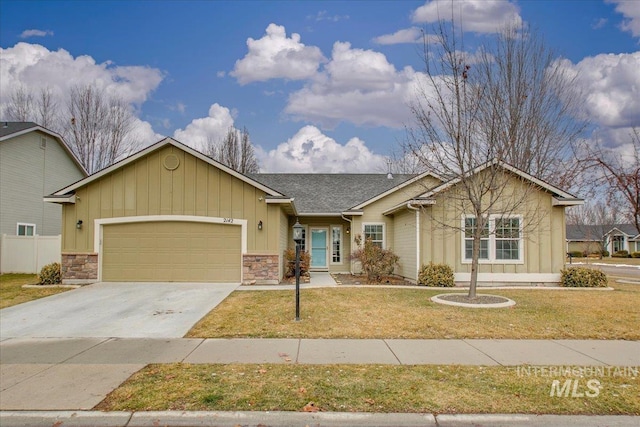 view of front of property featuring a garage and a front lawn