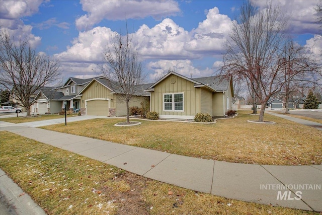 single story home featuring a garage and a front yard