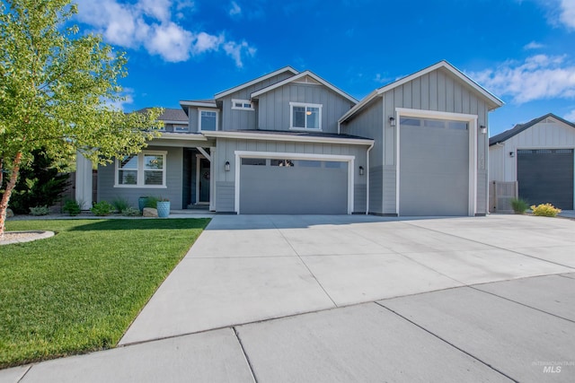 2649 E Mardia St, Meridian, ID 83642 - view of front facade with board and batten siding, a front lawn, concrete driveway, and a garage