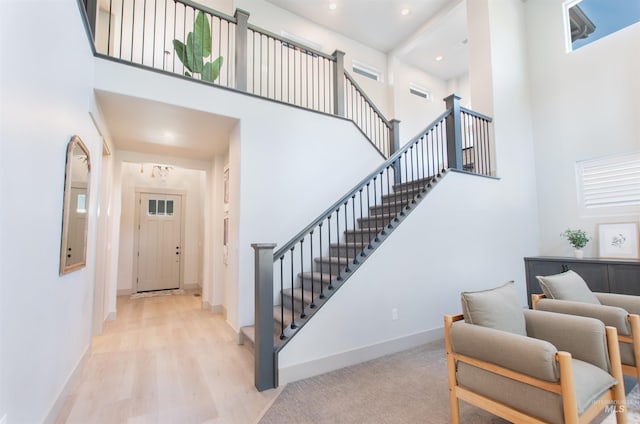 2649 E Mardia St, Meridian, ID 83642 - foyer entrance with a high ceiling, stairway, baseboards, recessed lighting, and wood finished floors