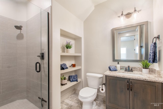 2649 E Mardia St, Meridian, ID 83642 - bathroom featuring vanity, a stall shower, built in shelves, and toilet