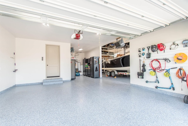 2649 E Mardia St, Meridian, ID 83642 - garage with a garage door opener, freestanding refrigerator, water heater, and baseboards